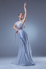 Image showing The beautiful ballerina dancing in blue long dress 