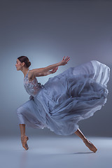 Image showing The beautiful ballerina dancing in blue long dress 