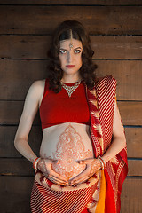 Image showing The pregnant woman with henna tattoo