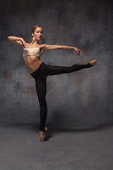 Image showing Young beautiful modern style dancer posing on a studio background