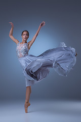 Image showing The beautiful ballerina dancing in blue long dress 