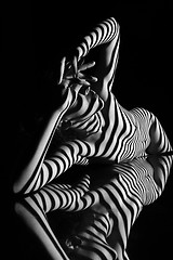 Image showing The nude woman with black and white zebra stripes