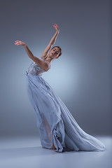 Image showing The beautiful ballerina dancing in blue long dress 