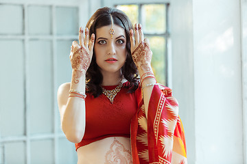 Image showing Indian picture on woman hands, mehendi tradition decoration