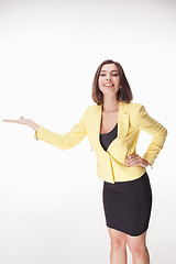 Image showing young business woman showing something on the white background