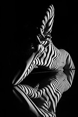 Image showing The nude woman with black and white zebra stripes