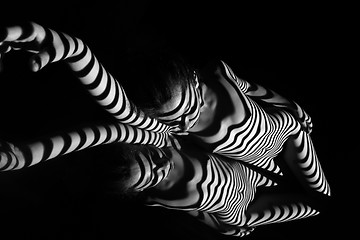 Image showing The nude woman with black and white zebra stripes