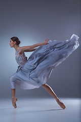 Image showing The beautiful ballerina dancing in blue long dress 