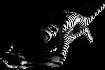 Image showing The nude woman with black and white zebra stripes