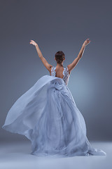 Image showing The beautiful ballerina dancing in blue long dress 