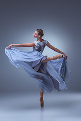 Image showing The beautiful ballerina dancing in blue long dress 