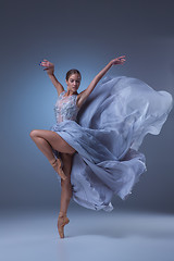 Image showing The beautiful ballerina dancing in blue long dress 