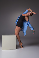 Image showing Young beautiful modern style dancer posing on a studio background