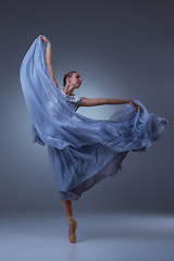 Image showing The beautiful ballerina dancing in blue long dress 