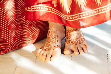 Image showing Legs decorated with indian mehandi painted henna close up