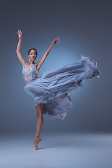 Image showing The beautiful ballerina dancing in blue long dress 