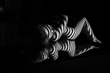 Image showing The nude woman with black and white zebra stripes