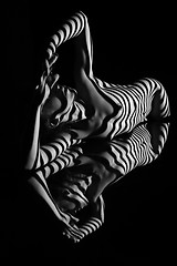 Image showing The nude woman with black and white zebra stripes