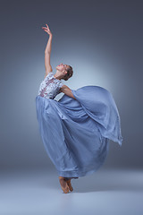 Image showing The beautiful ballerina dancing in blue long dress 