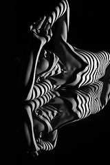 Image showing The nude woman with black and white zebra stripes