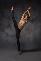 Image showing Young beautiful modern style dancer posing on a studio background