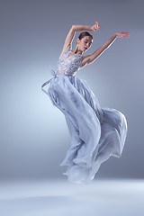 Image showing The beautiful ballerina dancing in blue long dress 