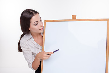 Image showing young business woman showing blank signboard on white background