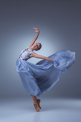 Image showing The beautiful ballerina dancing in blue long dress 
