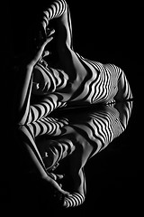 Image showing The nude woman with black and white zebra stripes