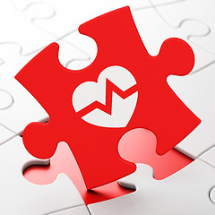 Image showing Medicine concept: Heart on puzzle background