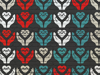 Image showing Insurance concept: Heart And Palm icons on wall background