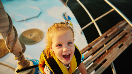 Image showing Little girl enjoying ride on yacht