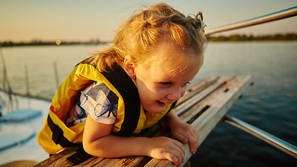 Image showing Little girl enjoying ride on yacht