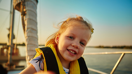 Image showing Little girl enjoying ride on yacht