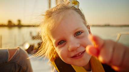 Image showing Little girl enjoying ride on yacht