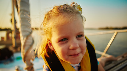 Image showing Little girl enjoying ride on yacht