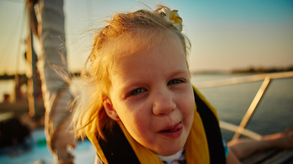 Image showing Little girl enjoying ride on yacht