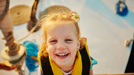 Image showing Little girl enjoying ride on yacht