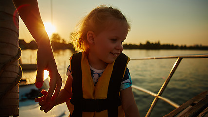 Image showing Little girl enjoying ride on yacht