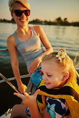 Image showing Mother, daughter on yacht.  Concept of the family