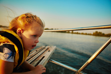 Image showing Little girl enjoying ride on yacht