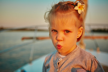 Image showing Little girl enjoying ride on yacht