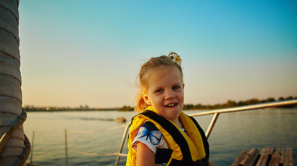 Image showing Little girl enjoying ride on yacht