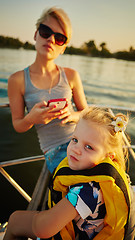 Image showing Mother, daughter on yacht.  Concept of the family