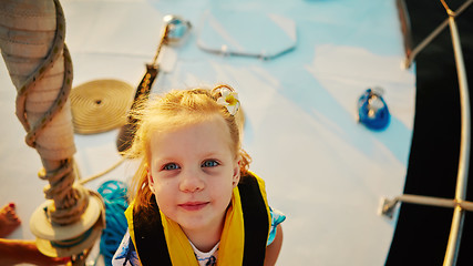 Image showing Little girl enjoying ride on yacht