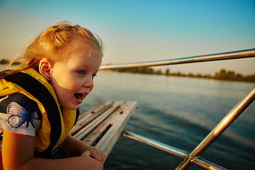 Image showing Little girl enjoying ride on yacht