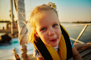 Image showing Little girl enjoying ride on yacht