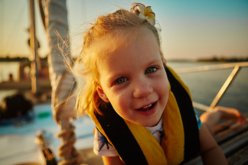 Image showing Little girl enjoying ride on yacht