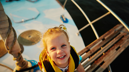 Image showing Little girl enjoying ride on yacht