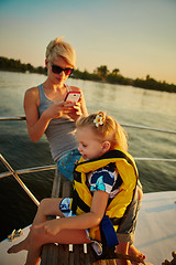 Image showing Mother, daughter on yacht.  Concept of the family